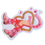 Rosa cowboystiefel und hufeisenbestickter aufnäher