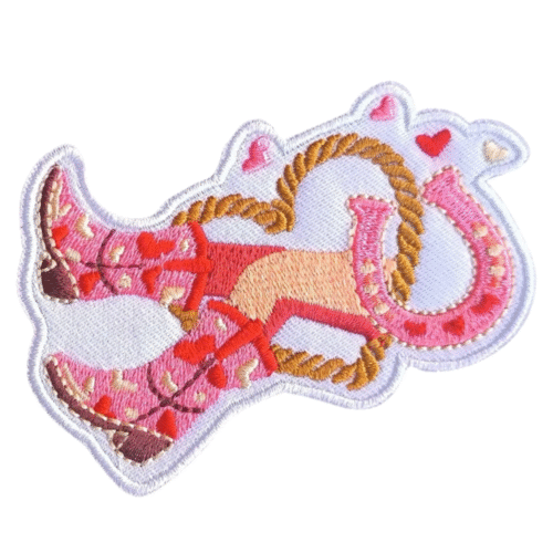 Rosa cowboystiefel und hufeisenbestickter aufnäher